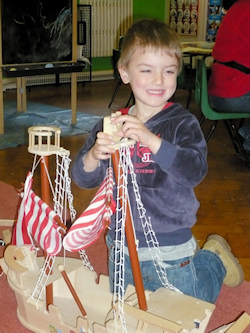 play with a wooden ship