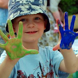 photo of children painting hands